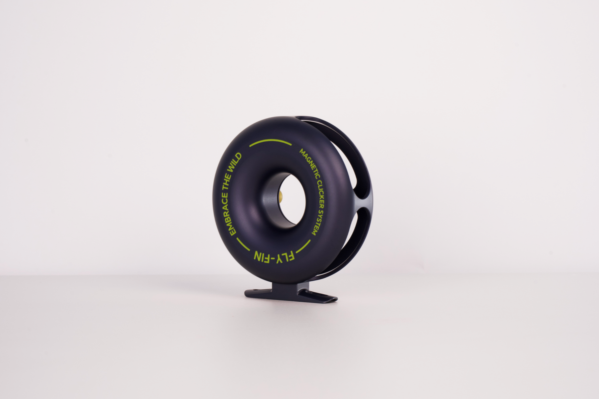 Actual Fly-Fin reel photograph showing the rounded rear shell and side cage