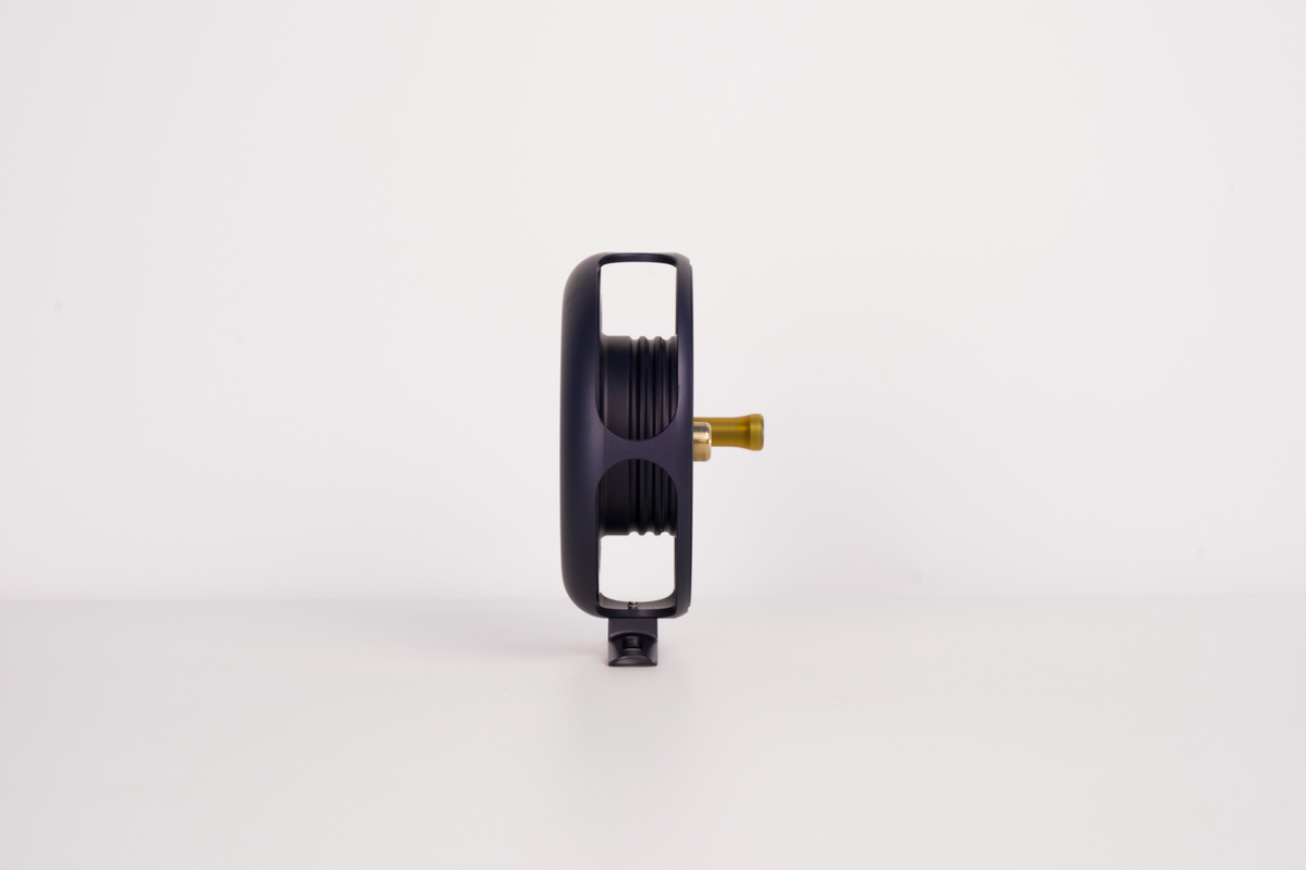 Actual side profile of the Fly-Fin reel, showing the rounded shell, spool and gold grip
